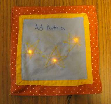 fabric square with some LEDs behind stars